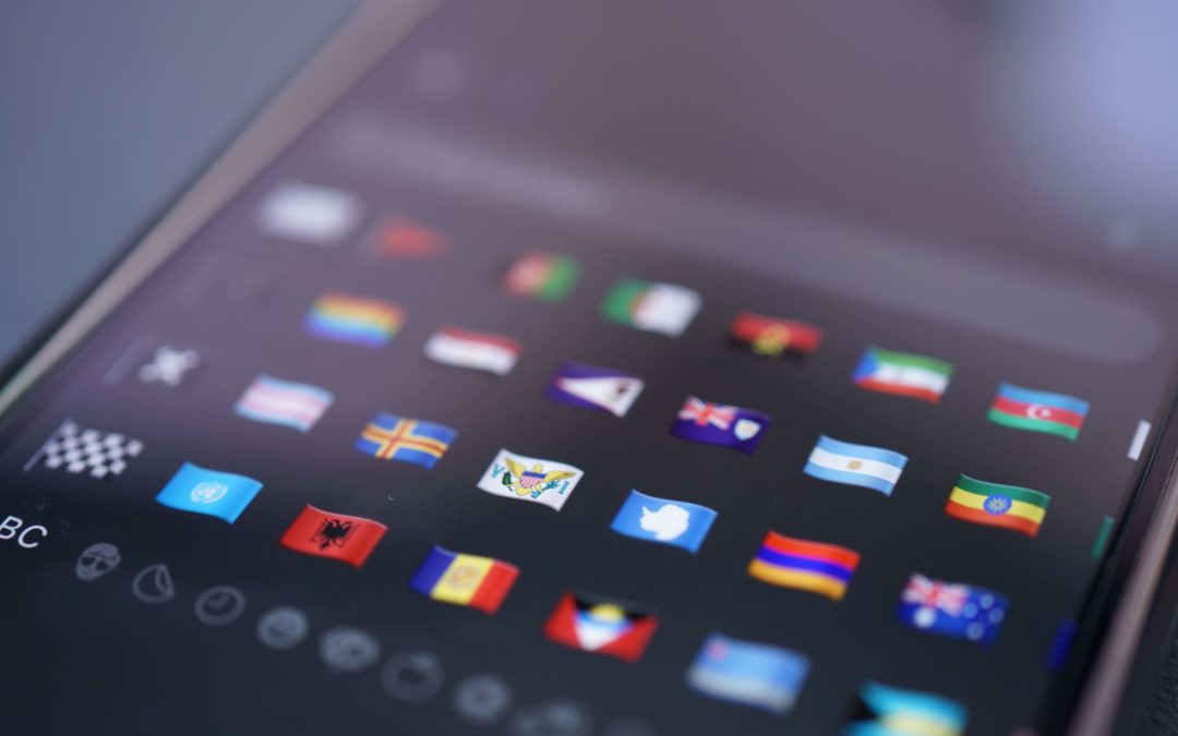 Website localization and multilingual translation interface displaying international language flags on a digital device for global business communication.
