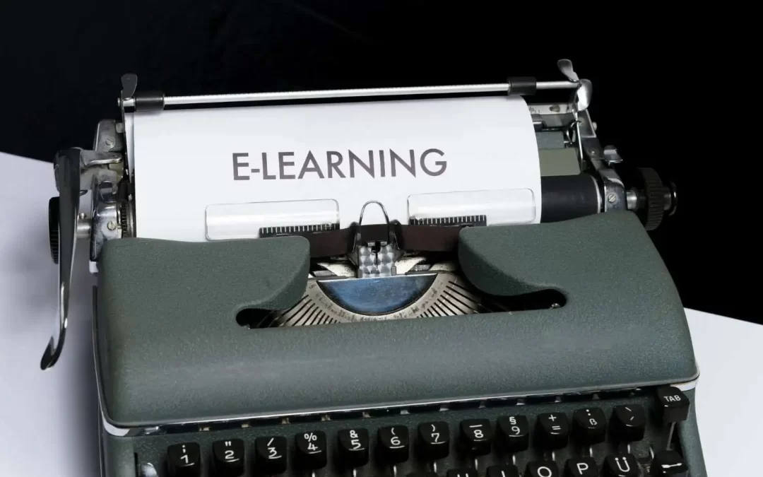 Vintage typewriter displaying the word “E-LEARNING” on paper, representing online language learning, digital education, and remote training.
