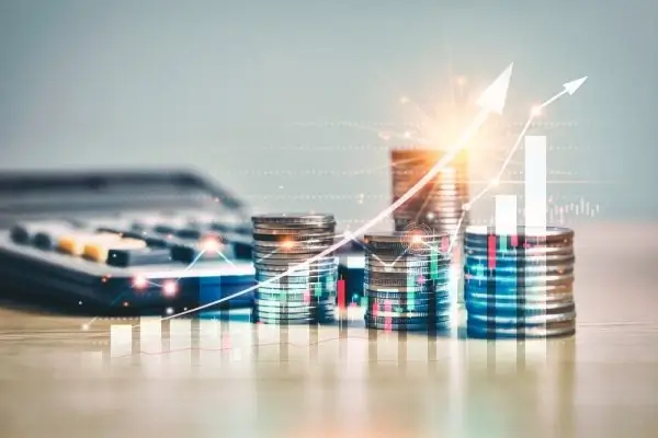 Stacks of coins with charts symbolizing financial growth and success