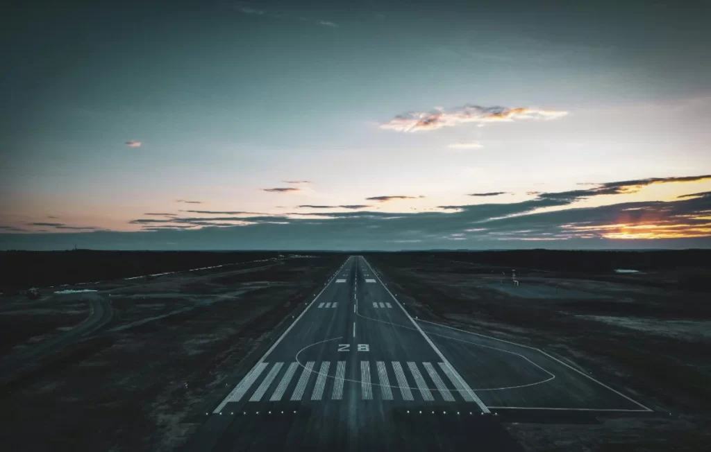 Airport runway at sunset representing professional aviation and aerospace game loclalization services