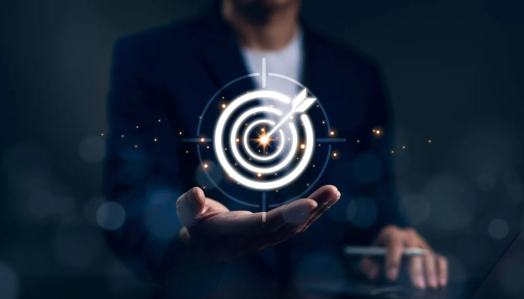 Business professional holding glowing digital target symbolizing precision and success
