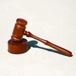 Language, Law, and Justice – PSP Languages "Wooden judge’s gavel on sound block symbolizing justice and authority
