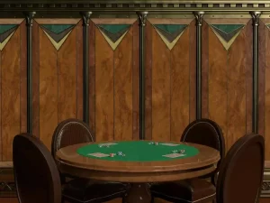 Casino poker table with playing cards, poker chips, and chairs in an elegant gaming room.