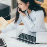 The lady managing documents for translation purpose at home