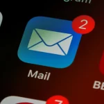 Close-up of smartphone screen showing Mail app with unread messages